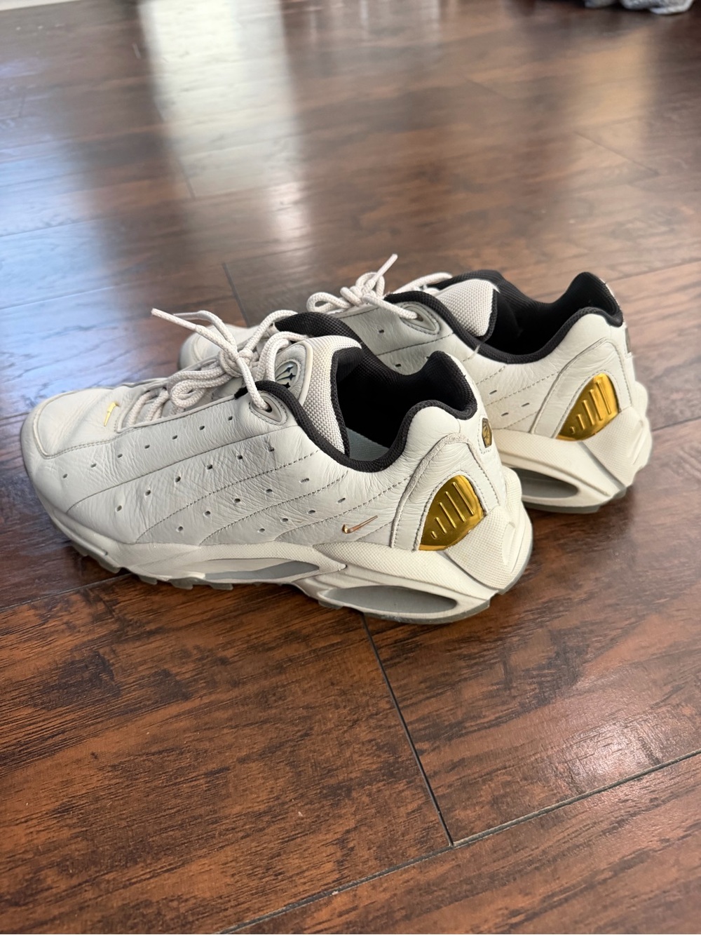 Nike Men’s White Sneakers with Gold Accents